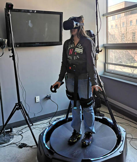 Game student using the Virtual Reality Treadmill